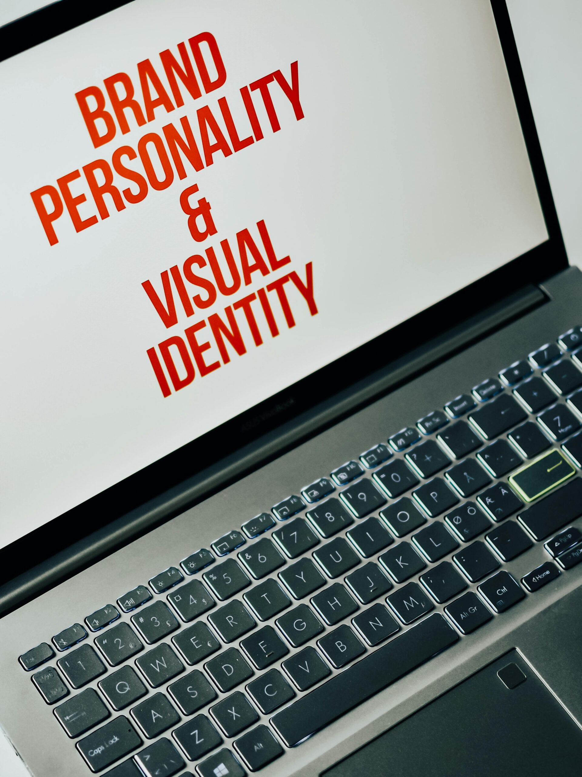 Laptop screen showing text on brand personality and visual identity for marketing strategy.
